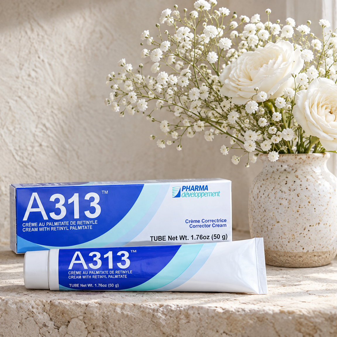 A313 retinol cream and box on a limestone windowsill with white roses