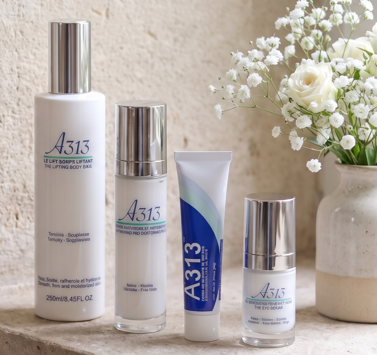 A313 skincare range on a stone windowsill with white roses